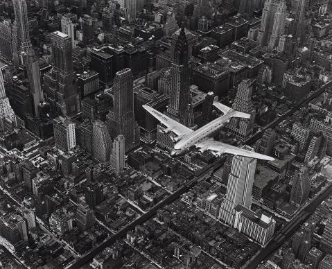 Margaret Bourke-White - A DC4 flying over New York City